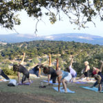 2016 PATHWAYS Summer Institute for Educators - participants doing morning Yoga